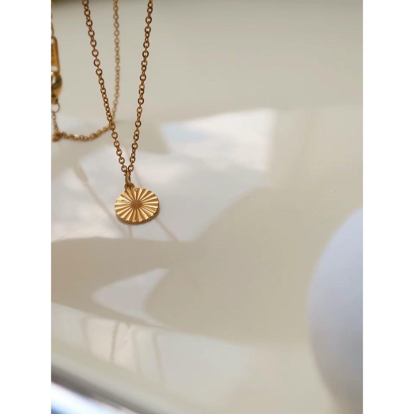GOLD SUN COIN NECKLACE